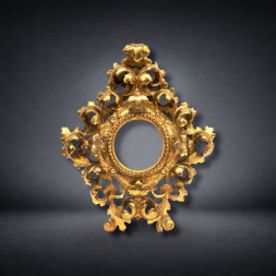 Cornice fiorentina in legno intagliato, traforato e dorato